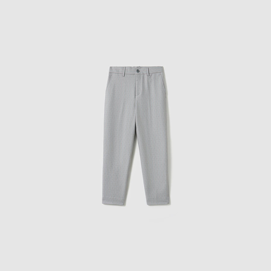 The Silver Bloom Suit Pants by KIKI and JOJO are light grey, straight-leg boys’ suit pants with pinstripes, button and zip closure, front pleats, and side pockets, shown against a plain white background.