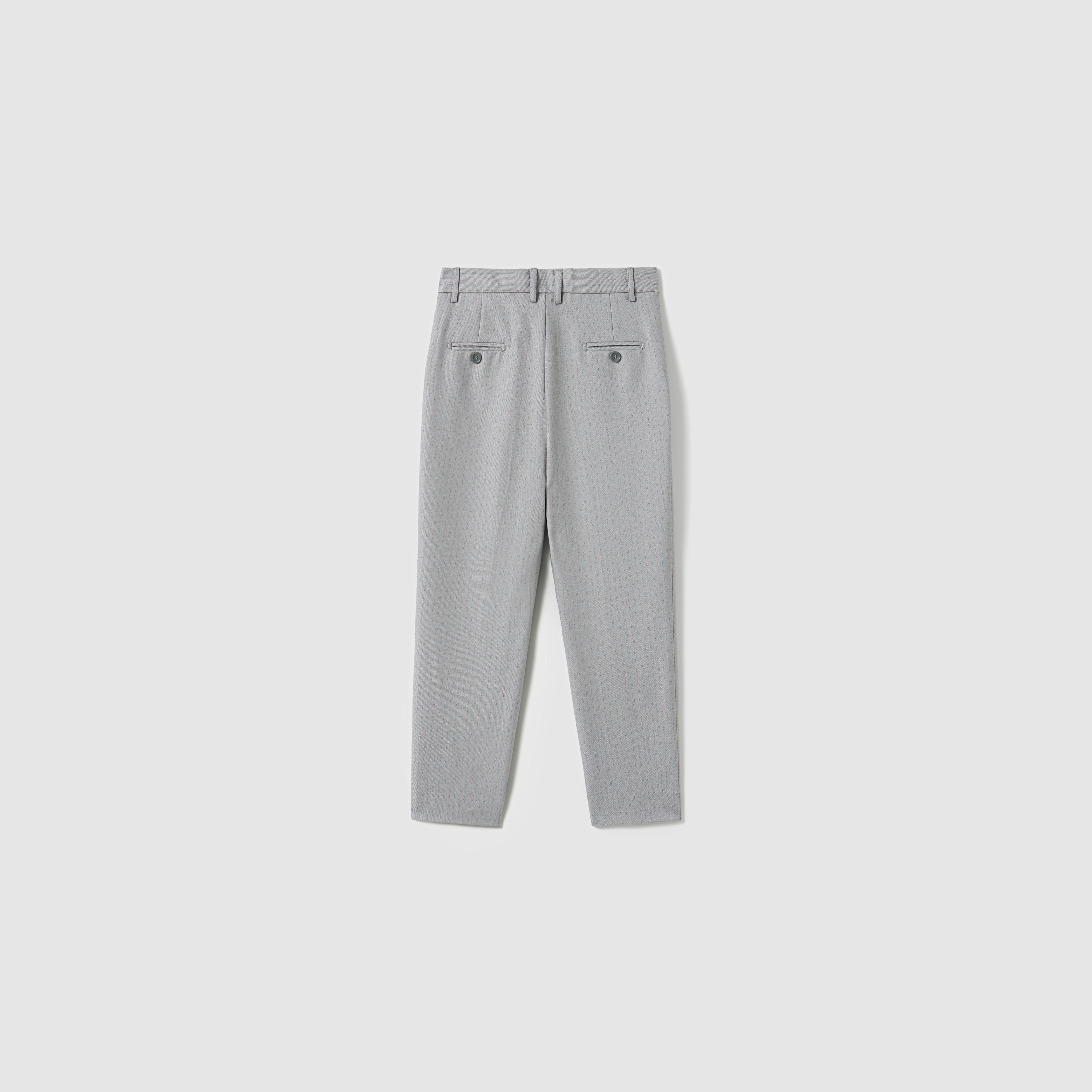Back view of KIKI and JOJO Silver Bloom Suit Pants for boys featuring belt loops, an adjustable waistband, and two buttoned back pockets, laid flat on a plain white background.
