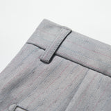 Close-up of the waistband and belt loop on KIKI and JOJO Silver Bloom Suit Pants, showcasing light gray pinstripes, textured fabric, and fine stitching details.