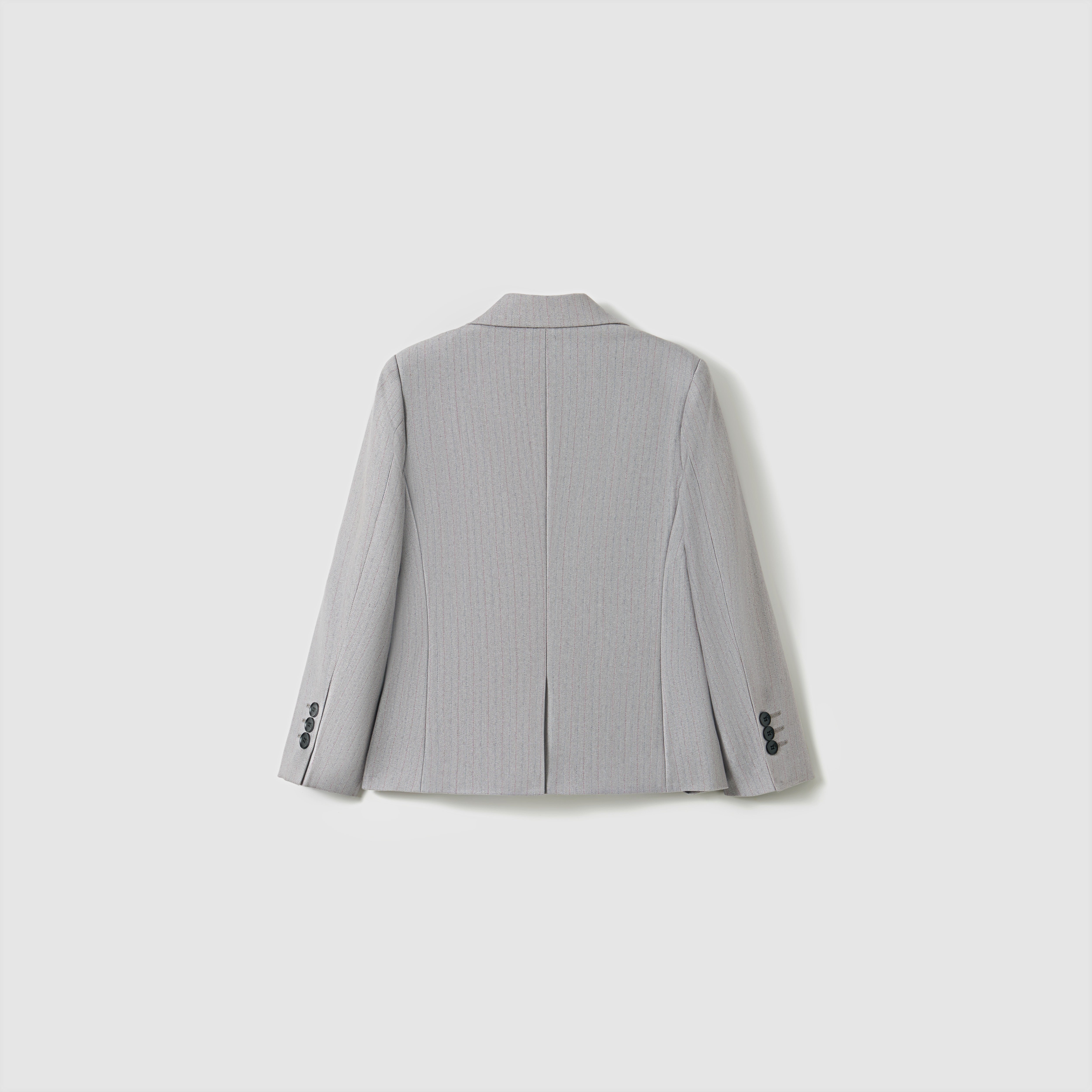 The KIKI and JOJO Silver Bloom Suit Jacket for boys is shown from the back in light gray stripes, featuring a center seam, two side vents, and buttoned cuffs—a stylish upgrade to any formal wardrobe.
