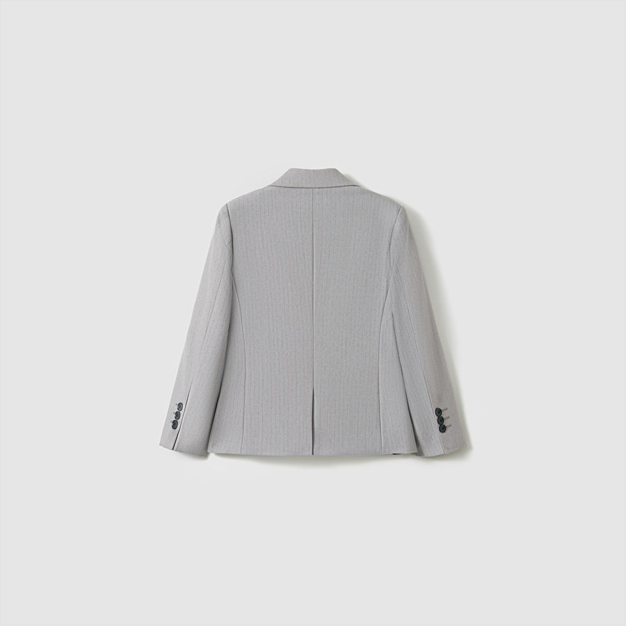 The KIKI and JOJO Silver Bloom Suit Jacket for boys is shown from the back in light gray stripes, featuring a center seam, two side vents, and buttoned cuffs—a stylish upgrade to any formal wardrobe.