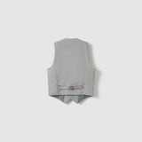 The KIKI and JOJO Silver Bloom Suit Vest is shown from the back, revealing an adjustable strap with buckle and a glimpse of its subtle patterned lining at the hem.