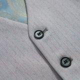 Close-up of the KIKI and JOJO Silver Bloom Suit Vest: light grey with thin red pinstripes, two black buttons, and a glimpse of its light blue patterned lining.