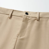 Close-up of KIKI and JOJO's Savoy Dune Suit Pants for boys, featuring belt loops, a button closure, adjustable waistband, and side pockets on a white background.