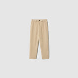 The Savoy Dune Suit Pants by KIKI and JOJO are beige boys' straight-leg dress pants with belt loops, side pockets, an adjustable waistband, and a front button closure, shown on a plain light gray background.