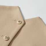 Close-up of a khaki beige blazer with two cream buttons and a welt pocket, ideal for pairing with the KIKI and JOJO Savoy Dune Suit Vest for any special occasion, displayed on a white background.