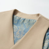 A close-up of the KIKI and JOJO Savoy Dune Suit Vest in khaki beige, featuring a blue and silver paisley lining—ideal for boys’ special occasions—shown against a plain white background.