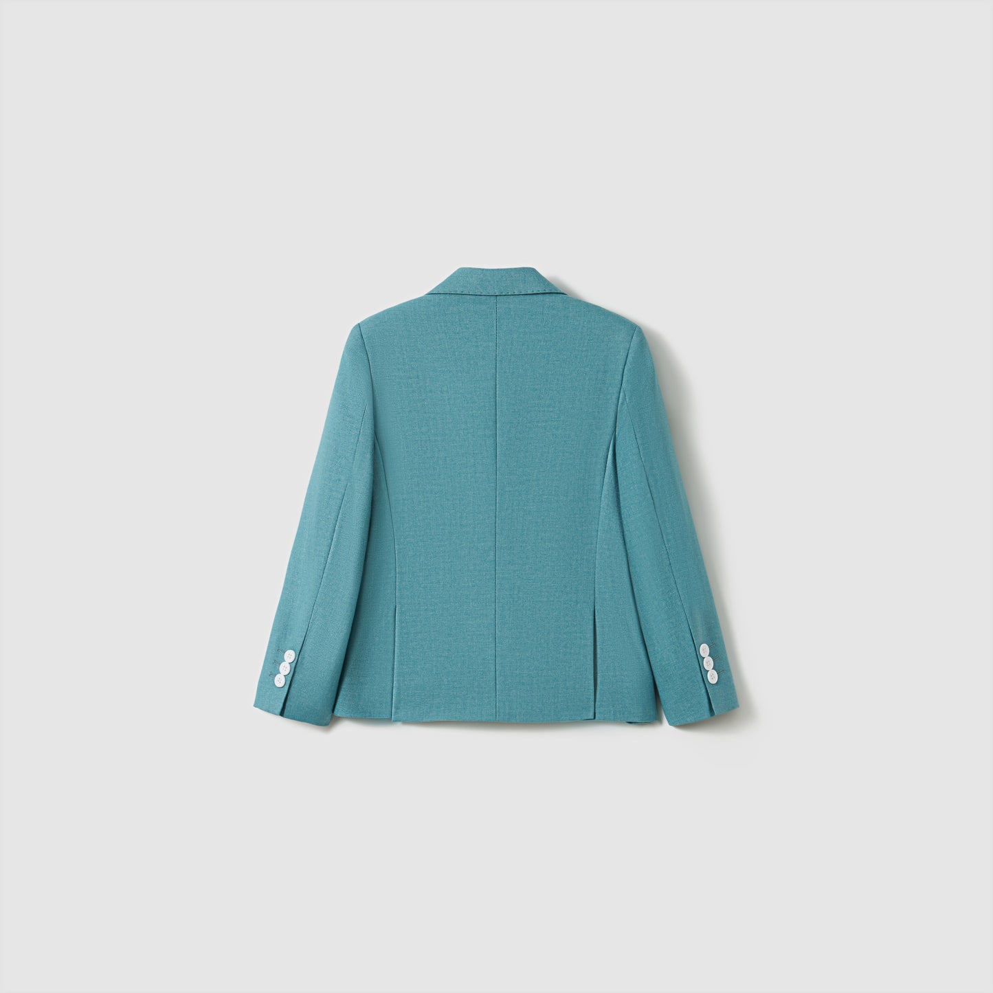 The Celeste Whimsy Suit Jacket by KIKI and JOJO is displayed from the back, showcasing a structured fit and white sleeve buttons against a simple light background.