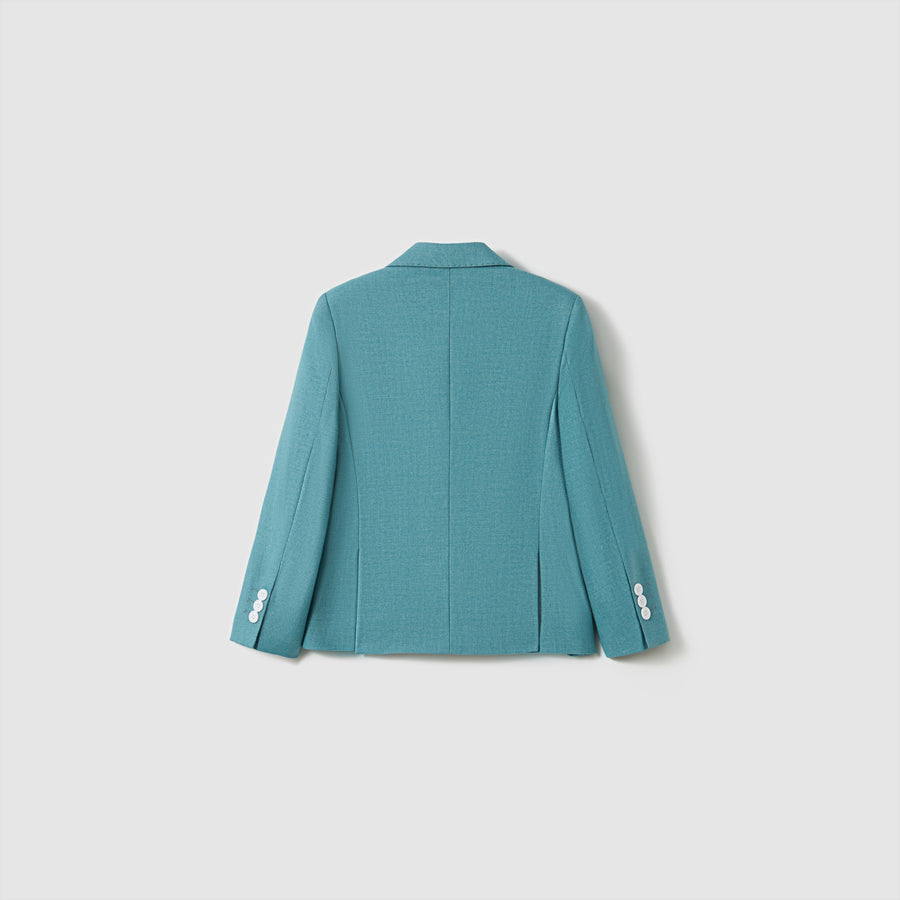The Celeste Whimsy Suit Jacket by KIKI and JOJO is displayed from the back, showcasing a structured fit and white sleeve buttons against a simple light background.