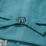 Close-up of the peacock blue fabric belt with metal buckle on the KIKI and JOJO Celeste Whimsy Suit Vest, showing its detailed texture and patterned lining—ideal for creating a polished formal look.