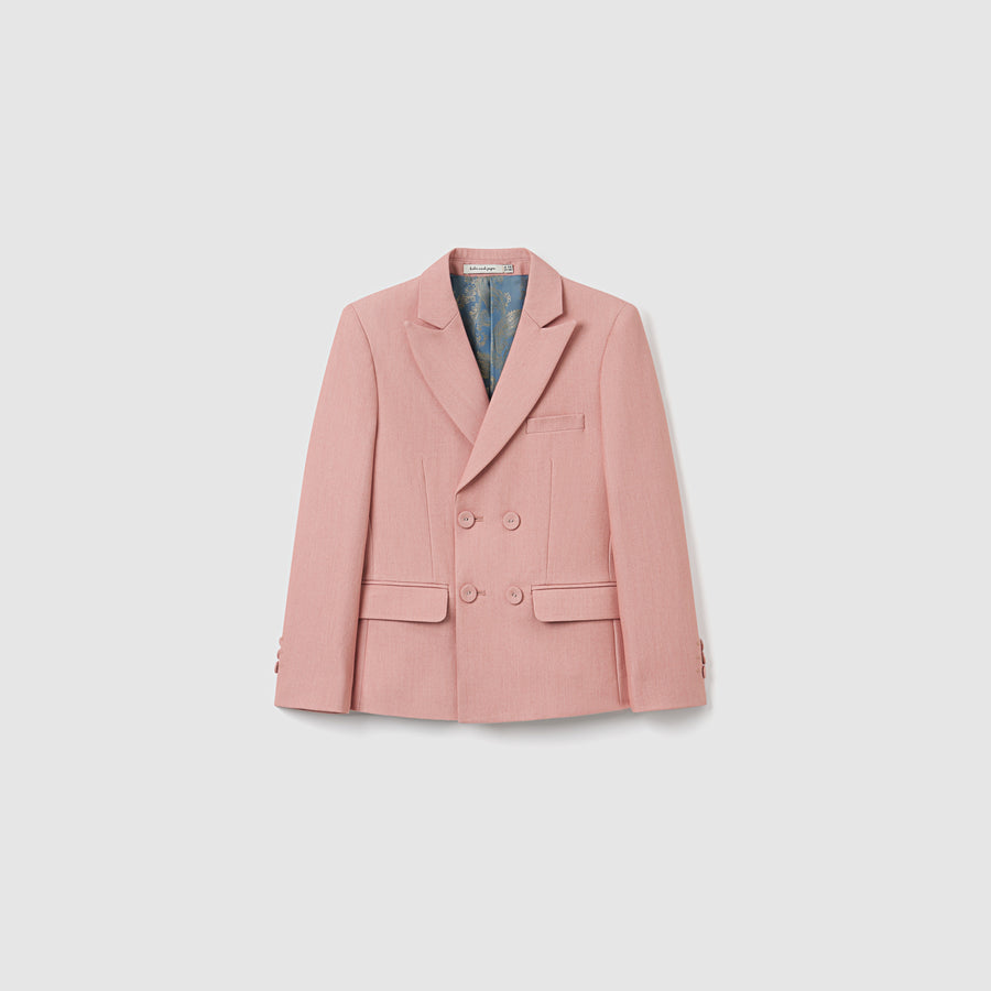 The KIKI and JOJO Blush Reverie Suit Jacket is a blush pink, double-breasted boys blazer with notch lapels, two front flap pockets, and a chest pocket—perfect for special occasions and shown against a plain white background.