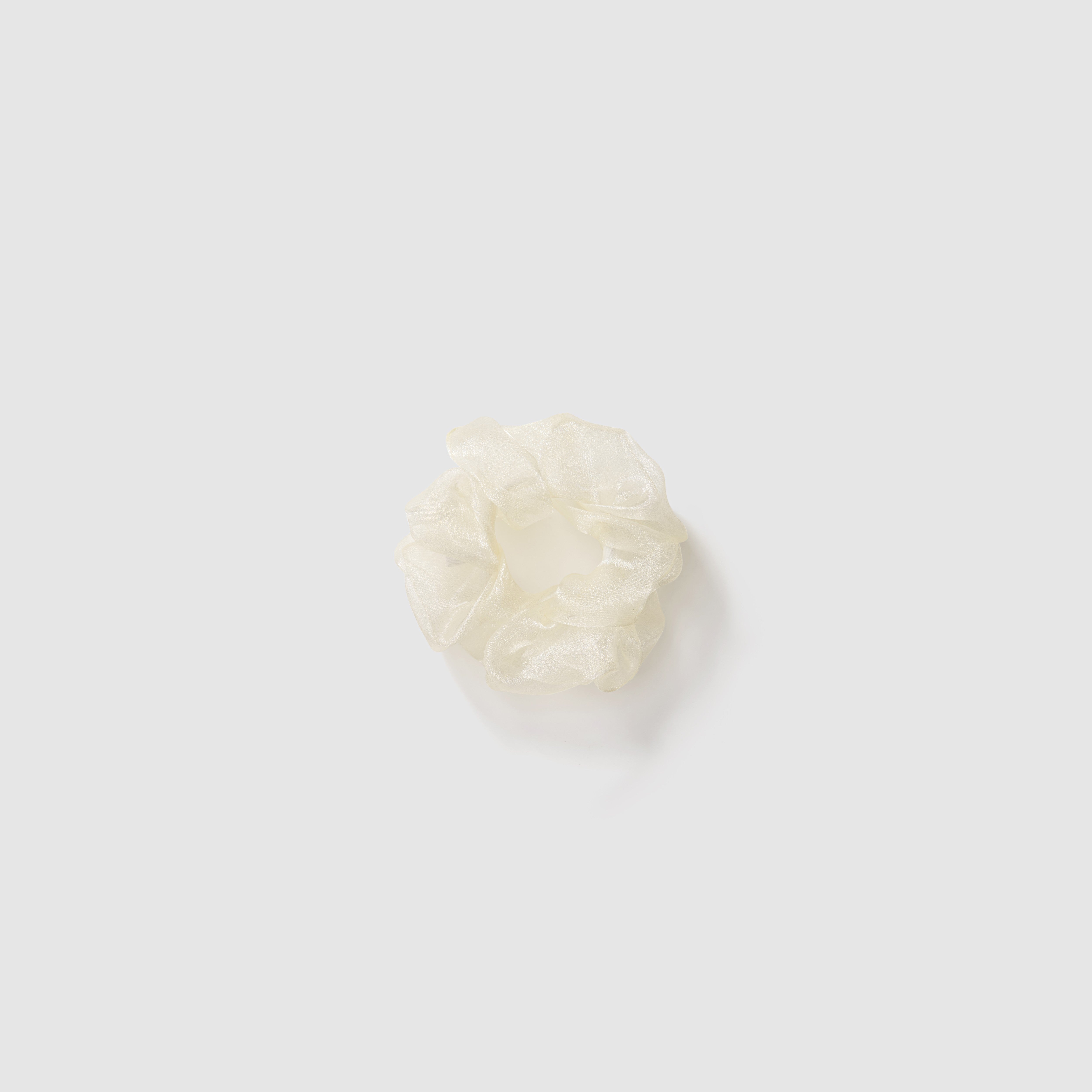 The KIKI and JOJO Girls Mini Pearl Sheen Organza Scrunchie set of 3 in Soft Gray, Blush Pink, and Ivory Cream is shown as delicate hair accessories centered on a plain light gray background.