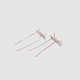 The KIKI and JOJO Girls Pink Beaded Bow Hair Clips, set of 2, are shown on a light grey background—one displays the beaded bow front, the other shows the metal clasp. These clips bring a soft, elegant touch to any hairstyle.
