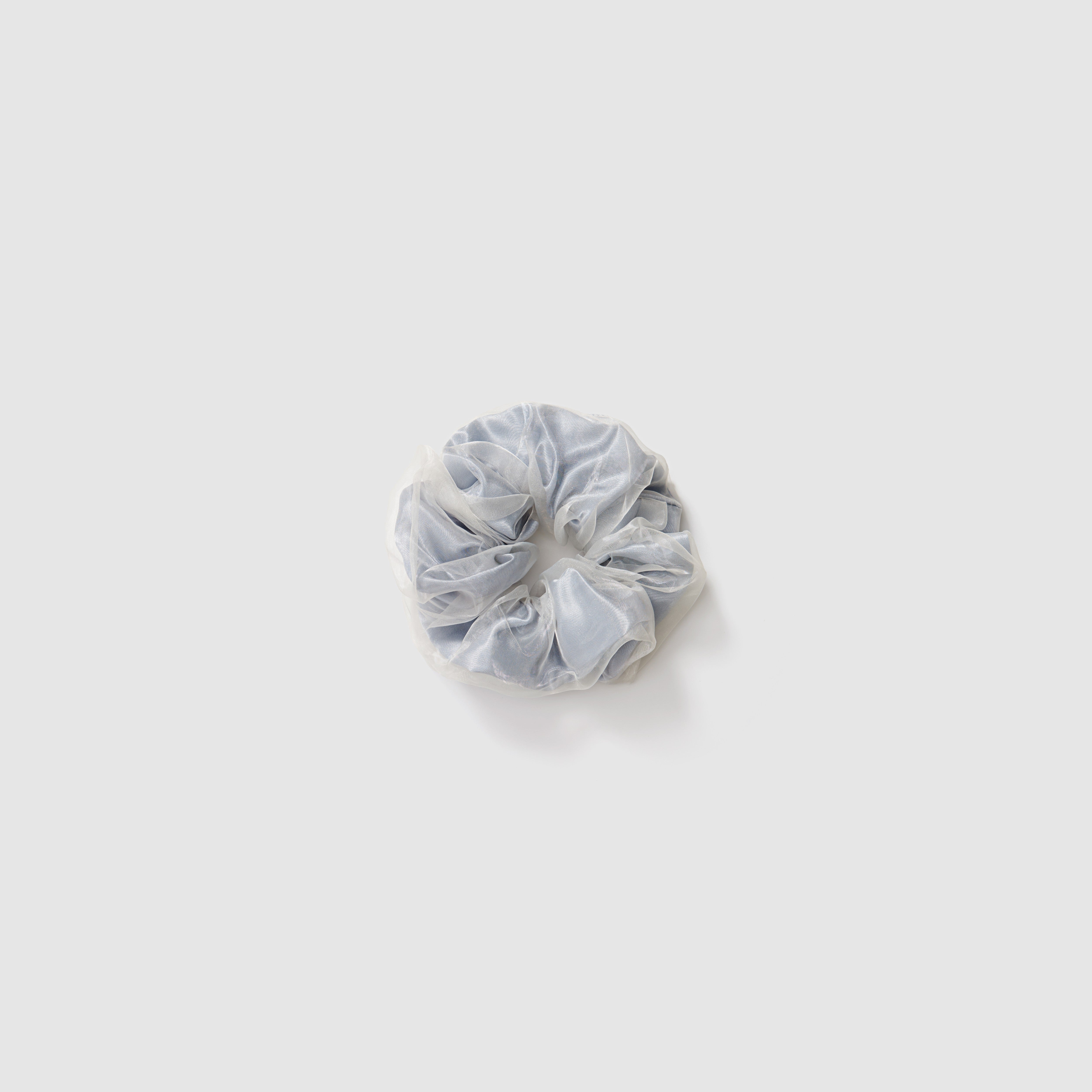 The KIKI and JOJO Girls Twilight Mist Grey Double-Layer Scrunchie, made from pearlescent mesh, is shown on a plain white background—an ideal gift presented in an organza pouch.