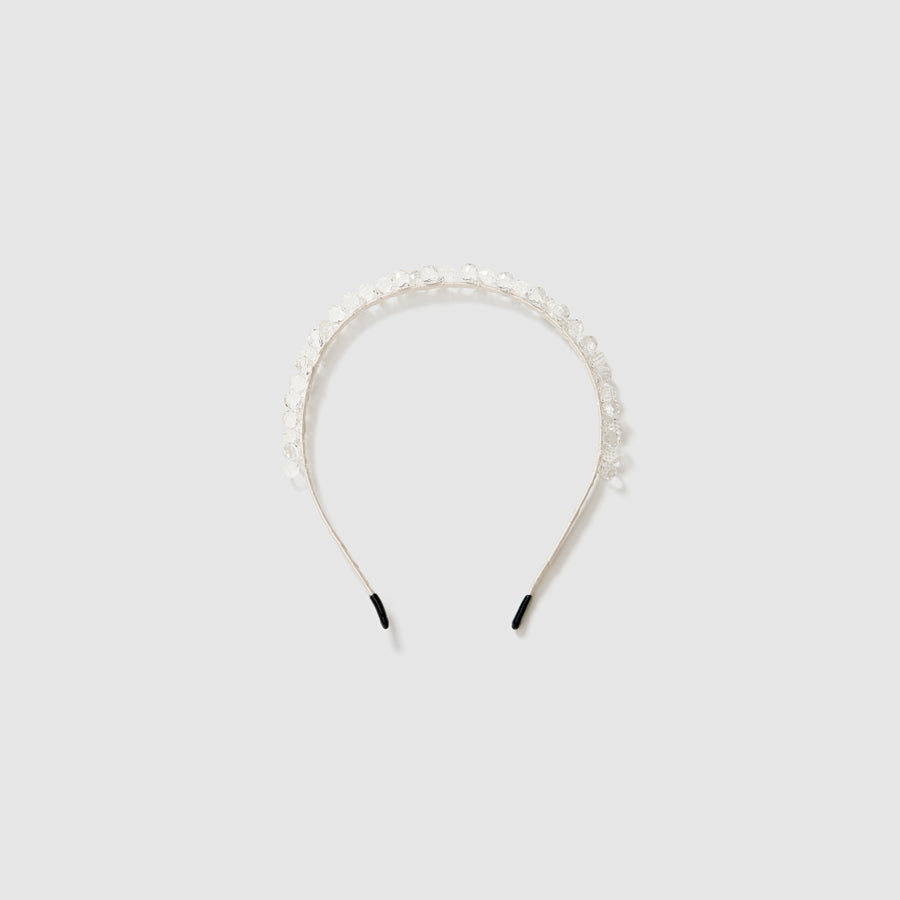 The KIKI and JOJO Girls Crystal Bead Headband features clear and white beads, making it a charming flower girl accessory. Shown on a light gray background.
