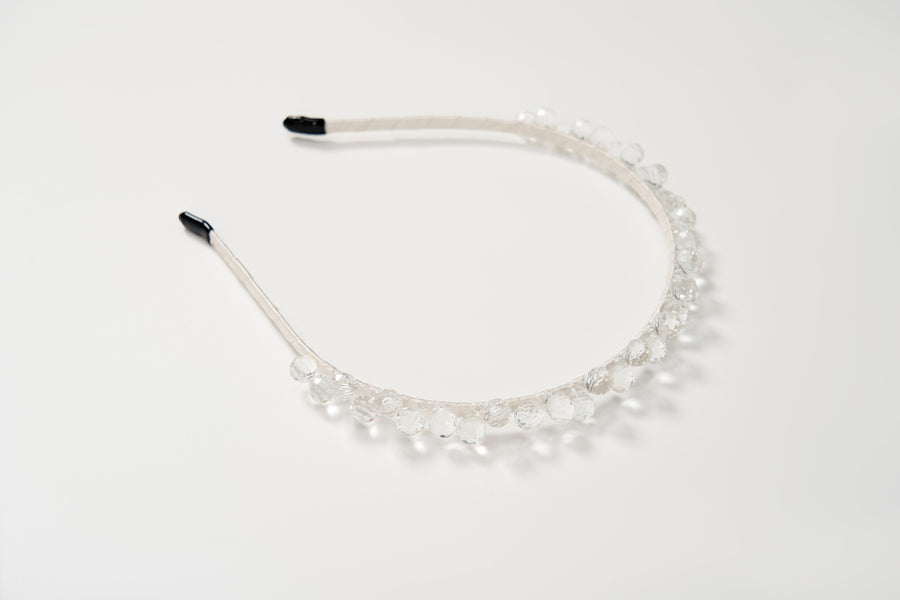 The KIKI and JOJO Girls Crystal Bead Headband, featuring clear round beads, makes a perfect birthday party hairpiece and is shown on a plain white background.