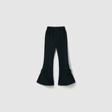 The Petal Whisper Dress Pants by KIKI and JOJO are flared black pants with an elastic waistband, side pockets, and bow accents at the lower legs, crafted from stretchy fabric and shown against a plain light background.