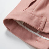 Close-up of the hem and waistband of KIKI and JOJO's Blush Reverie Suit Pants, featuring a belt loop, adjustable waistband, and inner white lining against a white background.