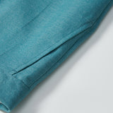 Close-up of KIKI and JOJO’s Celeste Whimsy Suit Pants for boys, showcasing a cuffed hem, adjustable waistband, and side pocket, photographed against a plain light background.