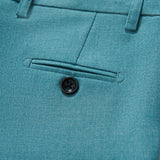 Close-up of the turquoise pocket with button on KIKI and JOJO's Celeste Whimsy Suit Pants for boys, featuring an adjustable waistband for a perfect fit.