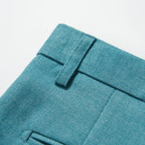 Close-up of the adjustable waistband and belt loop on KIKI and JOJO’s Celeste Whimsy Suit Pants, showcasing turquoise fabric, texture, and fine stitching.