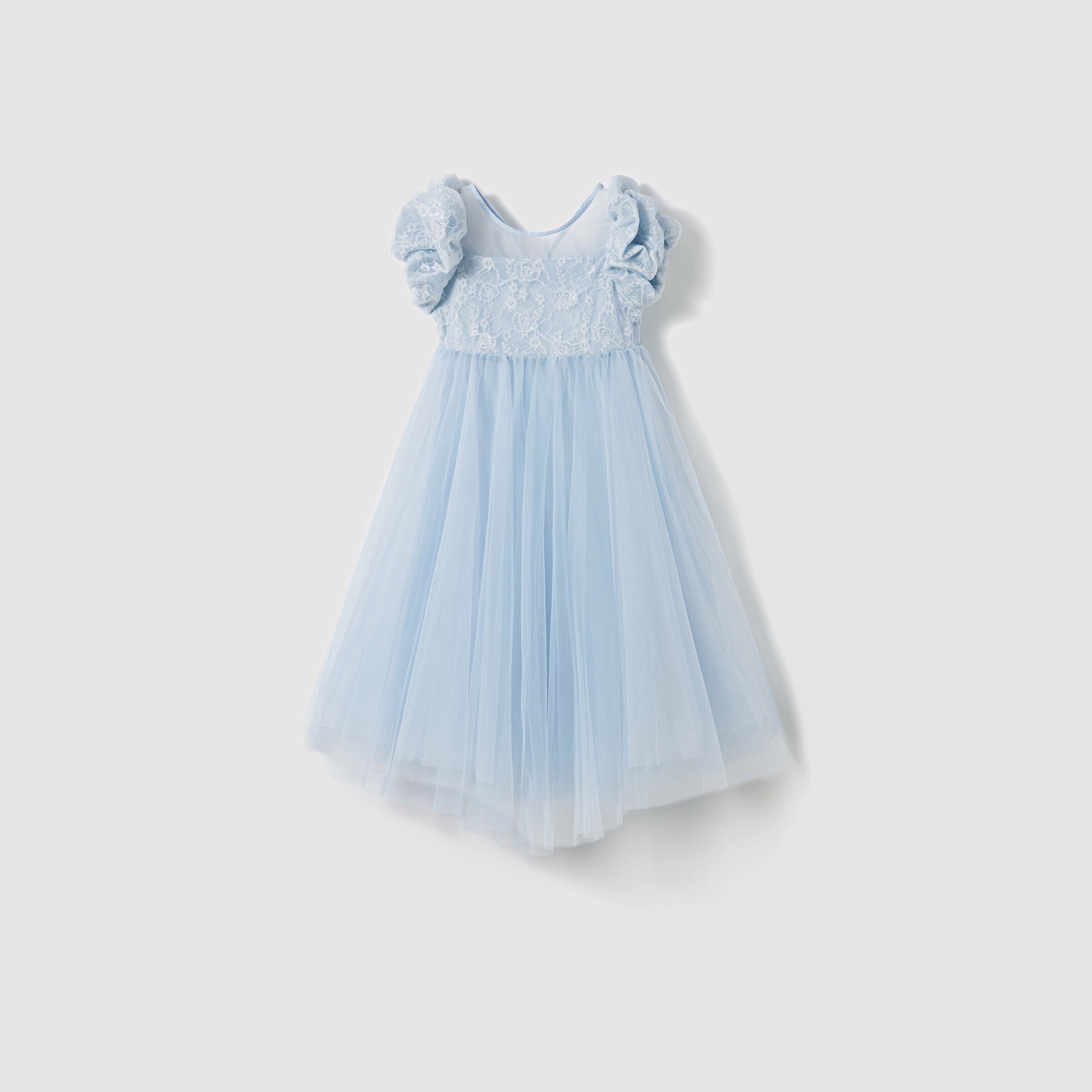 The KIKI and JOJO Sky Whisper Dress for girls features a lace bodice, ruffled short sleeves, and tulle skirt in light blue organza, shown on a plain white background.