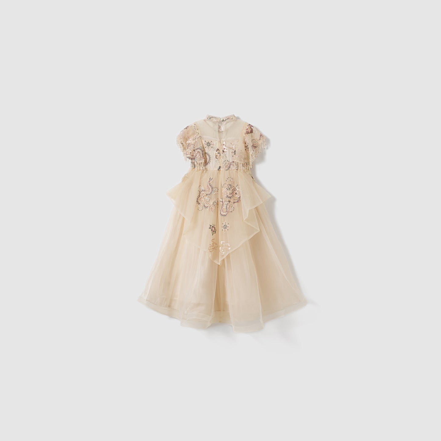 The Jade Whisper Dress by KIKI and JOJO is a cream, short-sleeved cheongsam with layered tulle, embroidered florals, and a high mandarin collar, shown against a plain white background.