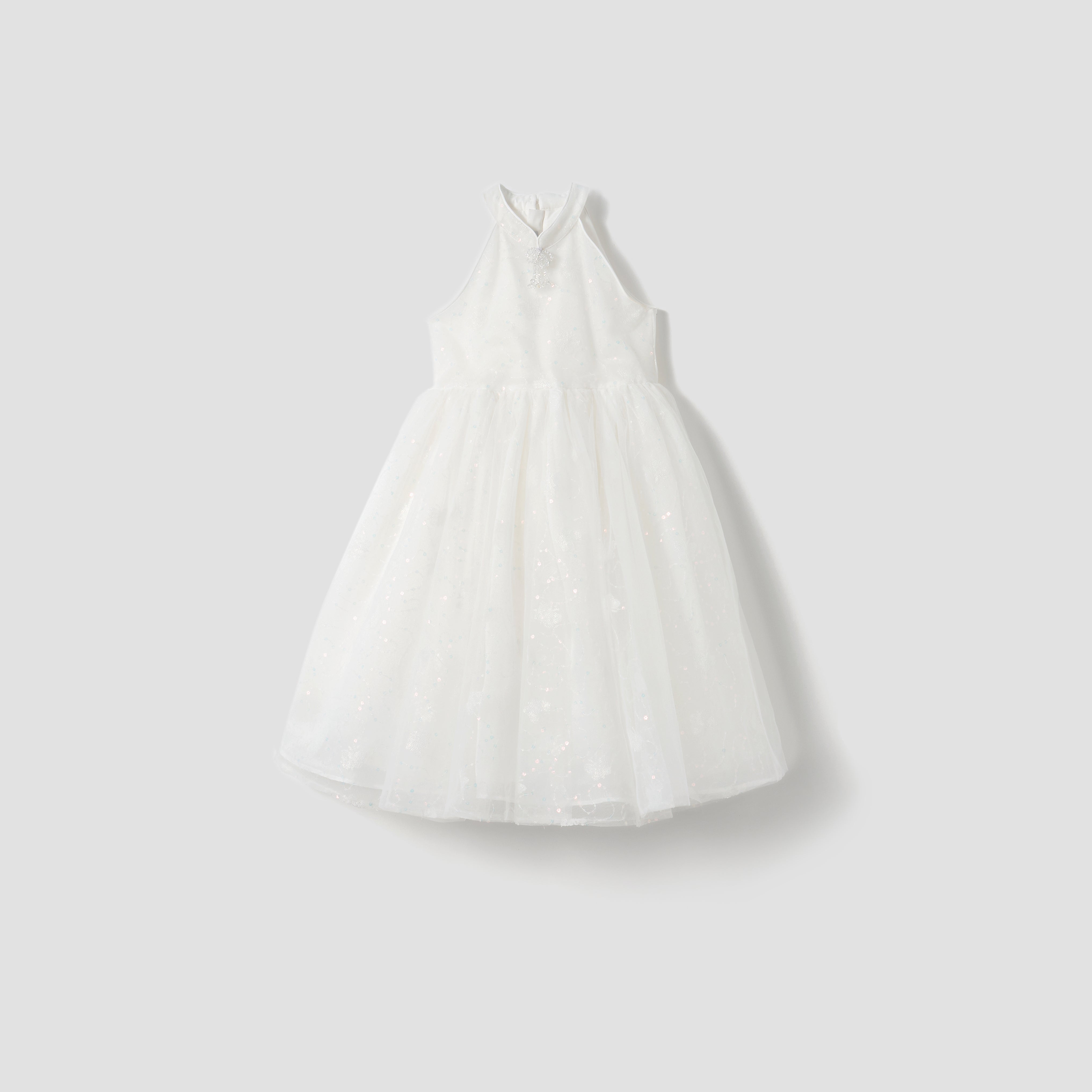 The Butterfly Whispers Dress by KIKI and JOJO features a sleeveless white halter top with butterfly details and a full, layered tulle skirt, shown against a plain light gray background.