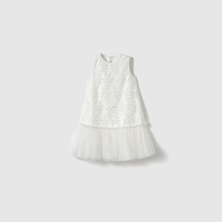 The Twinkle Whisper Dress by KIKI and JOJO features a sleeveless embroidered lace bodice and a tulle skirt, shown against a plain light background.