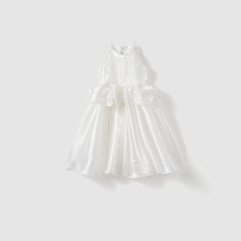 The KIKI and JOJO Pearl Glow Whisper Dress is a sleeveless white satin dress with a lace bodice, flared skirt, beaded embroidery, and side bows, shown against a plain light background.