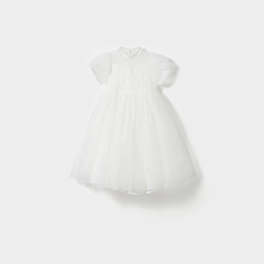 The Whisper Bloom Dress by KIKI and JOJO is a white, knee-length mini dress with short puffed sleeves, floral embroidery, bead accents, a fitted bodice, and a full tulle skirt shown against a plain white background.