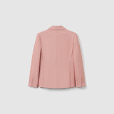The Blush Reverie Suit Jacket by KIKI and JOJO is displayed from the back, showcasing its light blush pink color, double-breasted design, long sleeves, and buttoned cuffs against a plain white background.
