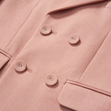 Close-up of the KIKI and JOJO Blush Reverie Suit Jacket, a blush pink, double-breasted boys blazer with lapel and two front pockets—perfect for special occasions.