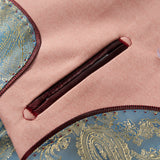 Close-up of the KIKI and JOJO Blush Reverie Suit Jacket, featuring a blush pink hue, burgundy-trimmed pocket, blue and gold paisley accents, and a translucent button—ideal for boys' special occasions.