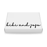 A white rectangular Gift Packaging box by KIKI and JOJO, featuring black cursive branding on the lid—an ideal choice for presenting special gifts.