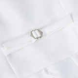 A detailed view of the KIKI and JOJO Kids Suit – White 3-Piece Set (3-14 Years, Classic Fit, Wrinkle-Free)—showing a silver rectangular buckle and decorative folded band—ideal for weddings.