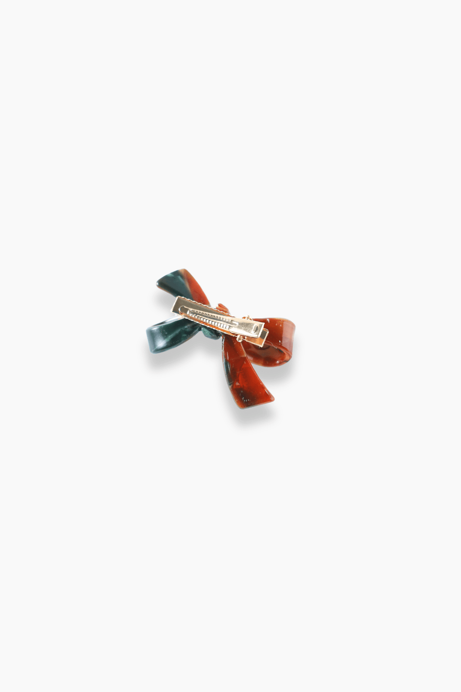 The KIKI and JOJO Girls Bow Hair Clip - Nature Palette features marbled red and deep forest green sections with a bow design and a gold metal clasp on the back.