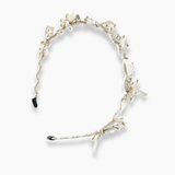 The KIKI and JOJO Girls Bow Hairband - Pearl features a cream hue with fabric flowers, leaves, pearl beads, and delicate bows. Photographed on a plain white background.