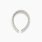 The KIKI and JOJO Girls Diamanté Padded Hairband in ivory features a textured, padded surface with sparkling diamanté accents and a curved, open-ended design, shown on a plain white background.