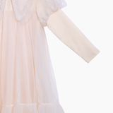 The KIKI and JOJO Girls Embroidered Satin Collar Sparkle Tulle Dress in beige/ivory features a long-sleeve faux two-piece design with a tulle overlay, embroidered satin collar, puffed shoulders, and a ruffled hem, shown on a white background.