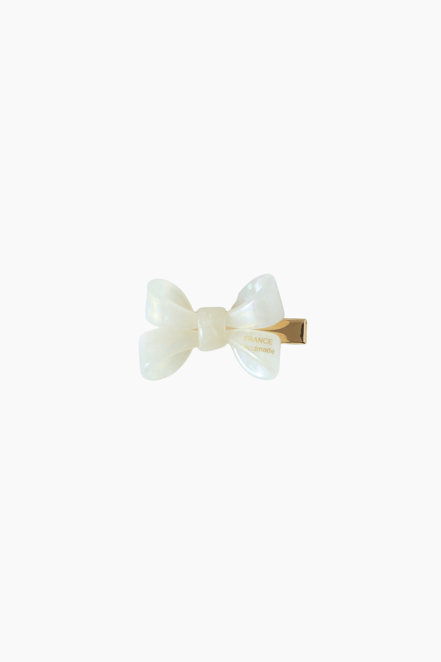 The Girls Iridescent Sheer Double Bow Hair Clip in ivory by KIKI and JOJO features a glossy double bow with a gold metal clasp, exuding playful elegance against a simple white background.