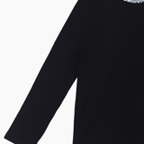 The KIKI and JOJO Girls Long-Sleeve Fitted T-Shirt with Sequin Collar in black features a stylish round neckline adorned with silver sequins—a must-have essential for any wardrobe.