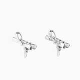 A set of two silver-plated metal bow hair clips from KIKI and JOJO, ideal as a charming gift for young girls, displayed on a simple white background.