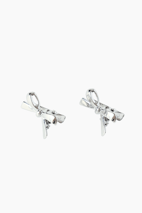 A set of two silver-plated metal bow hair clips from KIKI and JOJO, ideal as a charming gift for young girls, displayed on a simple white background.