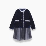 The KIKI and JOJO Girls Quilted Ruffle Jacket in Sapphire Blue features a diamond-quilted velvet top, white trim, petal-shaped buttons, and a layered tulle skirt for an elegant look.