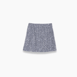 The Girls Sequin Skirt - Silver by KIKI and JOJO features a sparkling mini design, shown against a plain white background with shimmering sequins that catch the light beautifully.