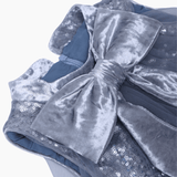 Close-up of the KIKI and JOJO Girls Sequin Tulle Dress in Starlight Blue, showcasing a large, shiny velvet bow and delicate sequin embroidery.