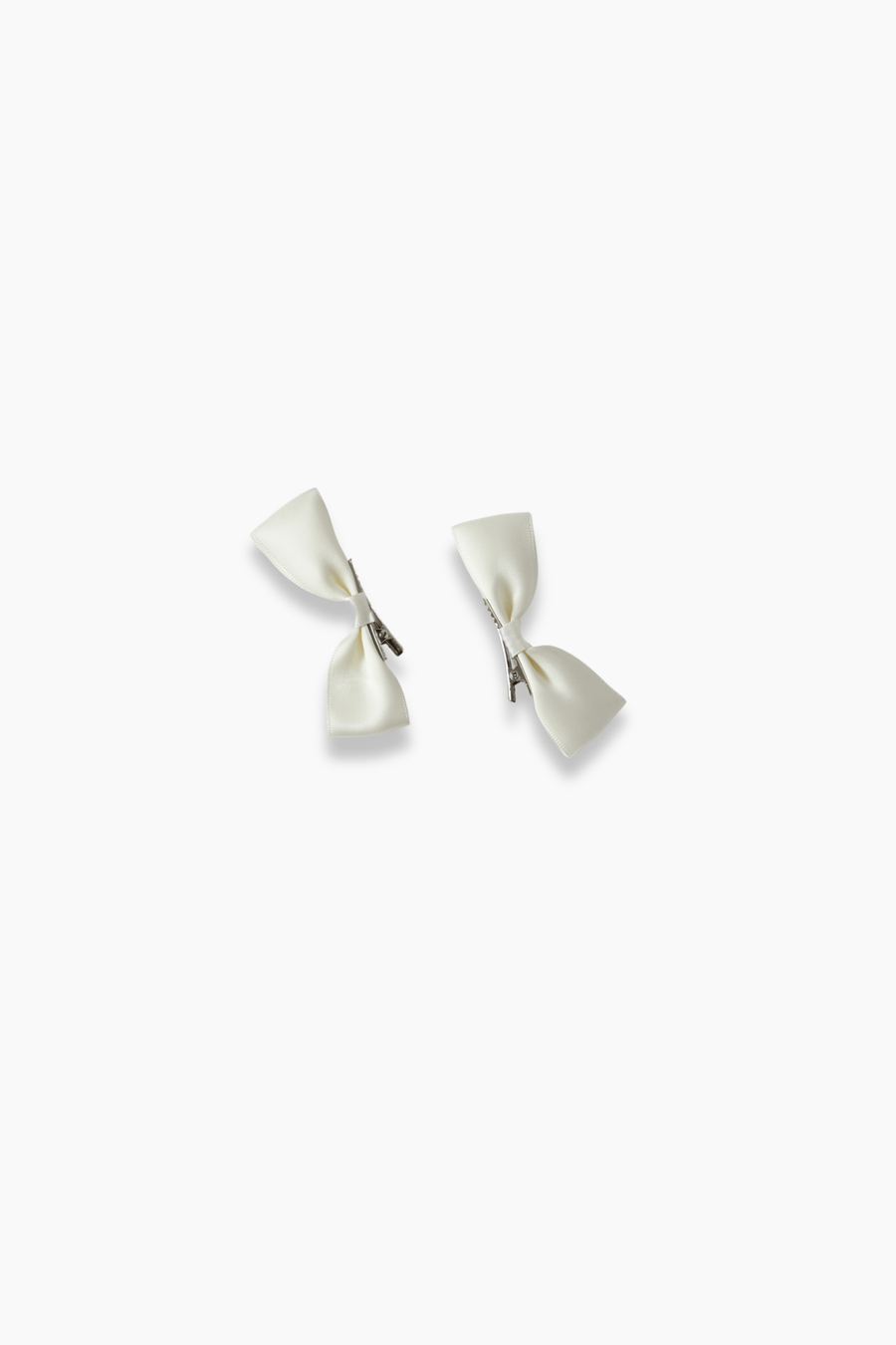 KIKI and JOJO Girls Silk Satin Ribbon Bow Hair Clips (2 Pack) in ivory feature small handmade bows with silver clasps, shown on a white background—an ideal, charming accessory for girls.