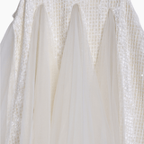 Close-up of the KIKI and JOJO Girls Textured Velvet Sleeveless Embroidered Dress in ivory, featuring a detailed embroidered bodice and a soft, elegant skirt—perfect for special occasions.