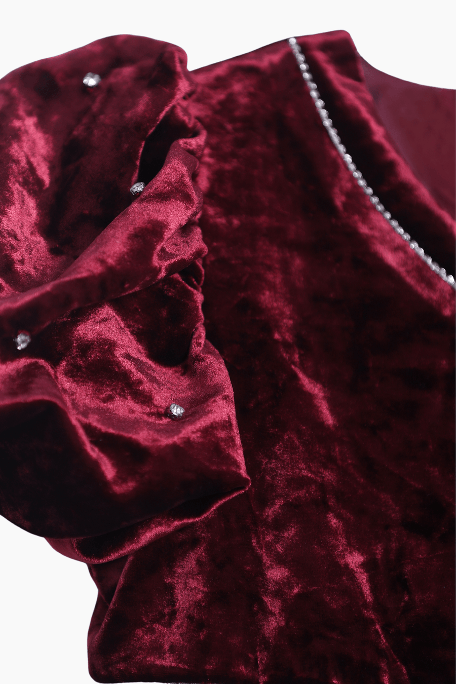The KIKI and JOJO Girls Velvet Puff Sleeve Dress in burgundy red features sparkling rhinestone trim and elegant puff sleeves—a luxurious choice for special occasions.